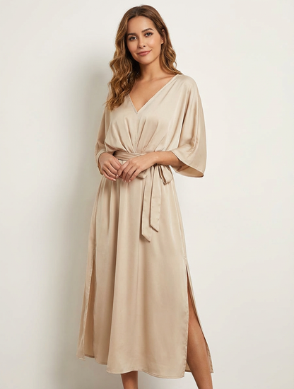 Elegante maxi jurk met strikceintuur en V-hals