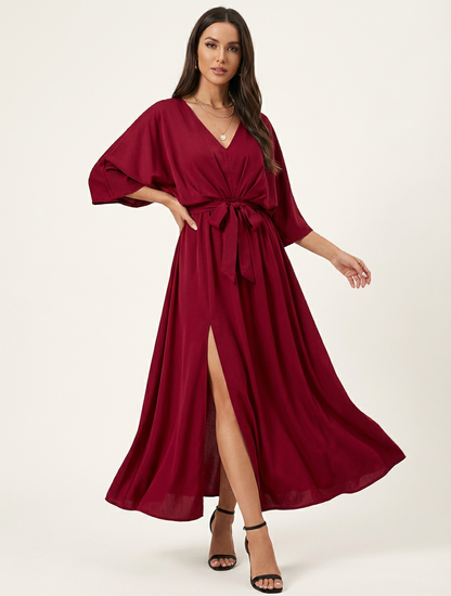 Elegante maxi jurk met strikceintuur en V-hals