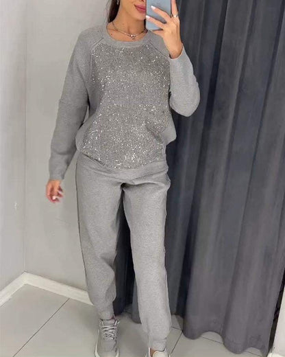 Trendy damespak met subtiele glansdetails