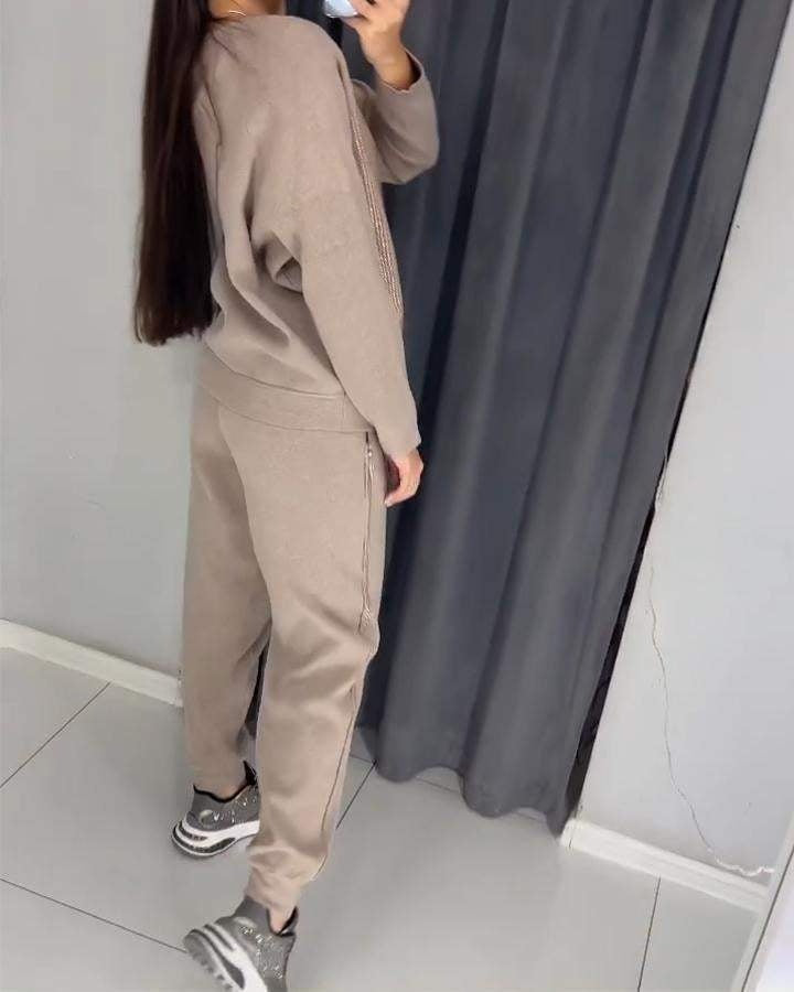 Trendy damespak met subtiele glansdetails