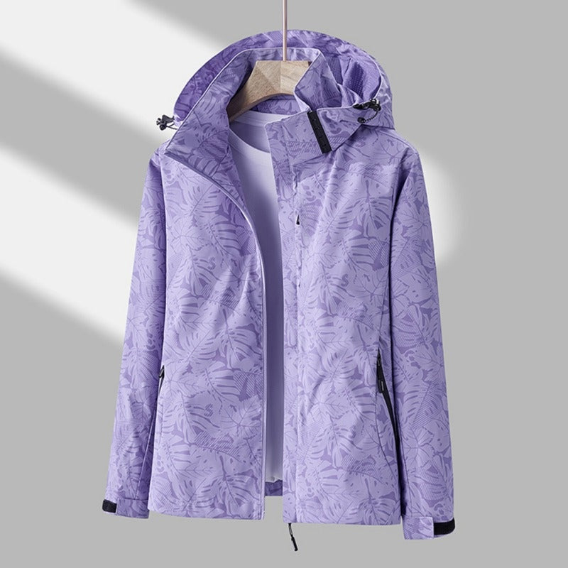 Waterafstotende dames outdoorjas met capuchon en bladprint